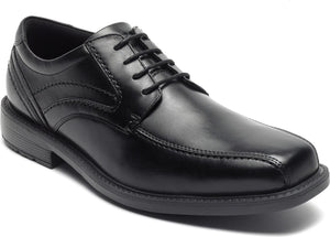 Black leather dress shoe with rounded square toe and lace-up closure.