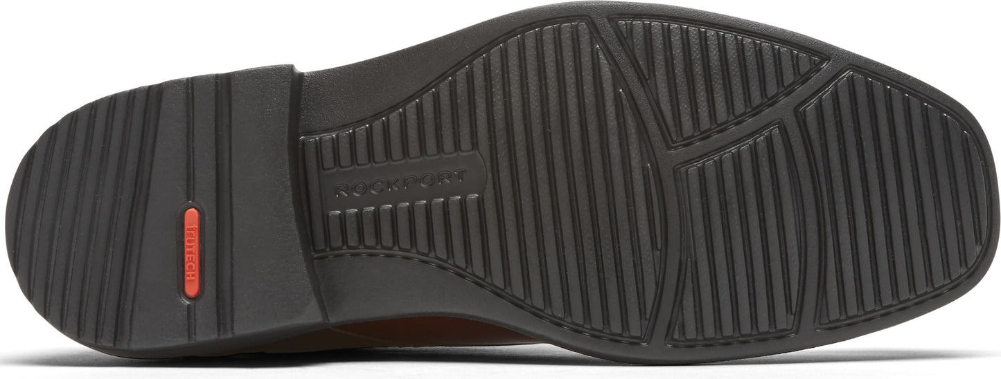 Sole of a shoe, textured with grooves and a Rockport logo.