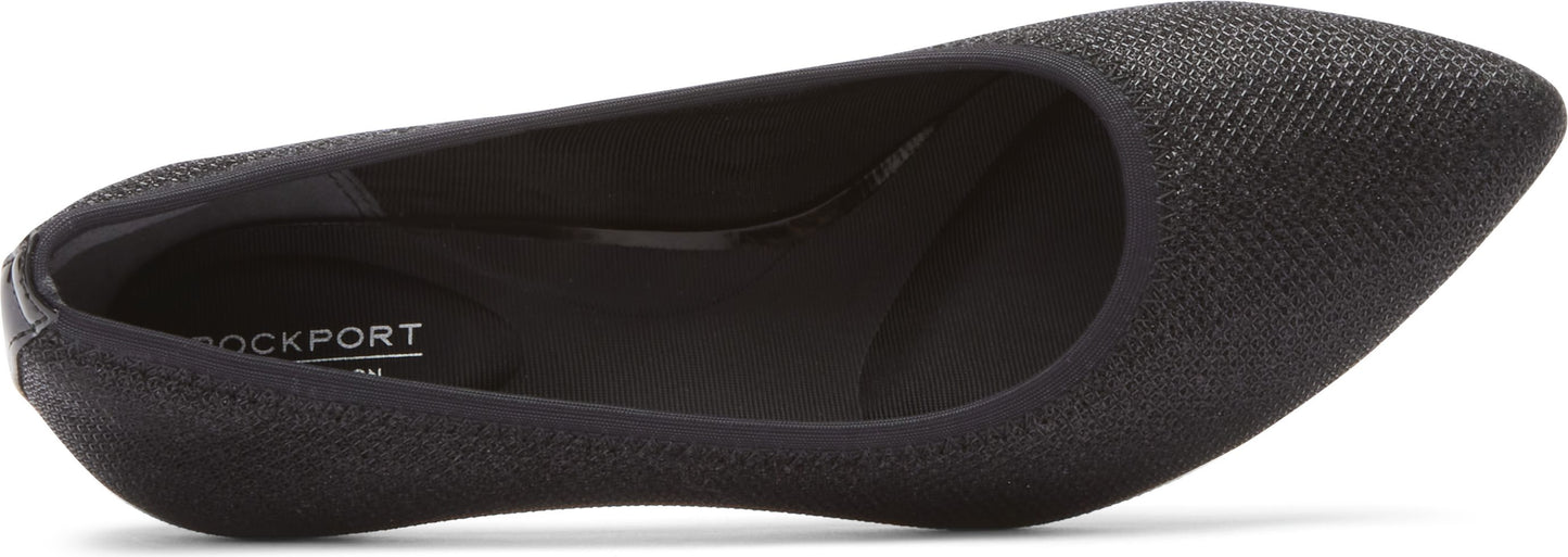 A black, pointed-toe, flat shoe.