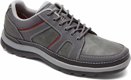 Gray athletic shoe with a flat heel and laced closure.