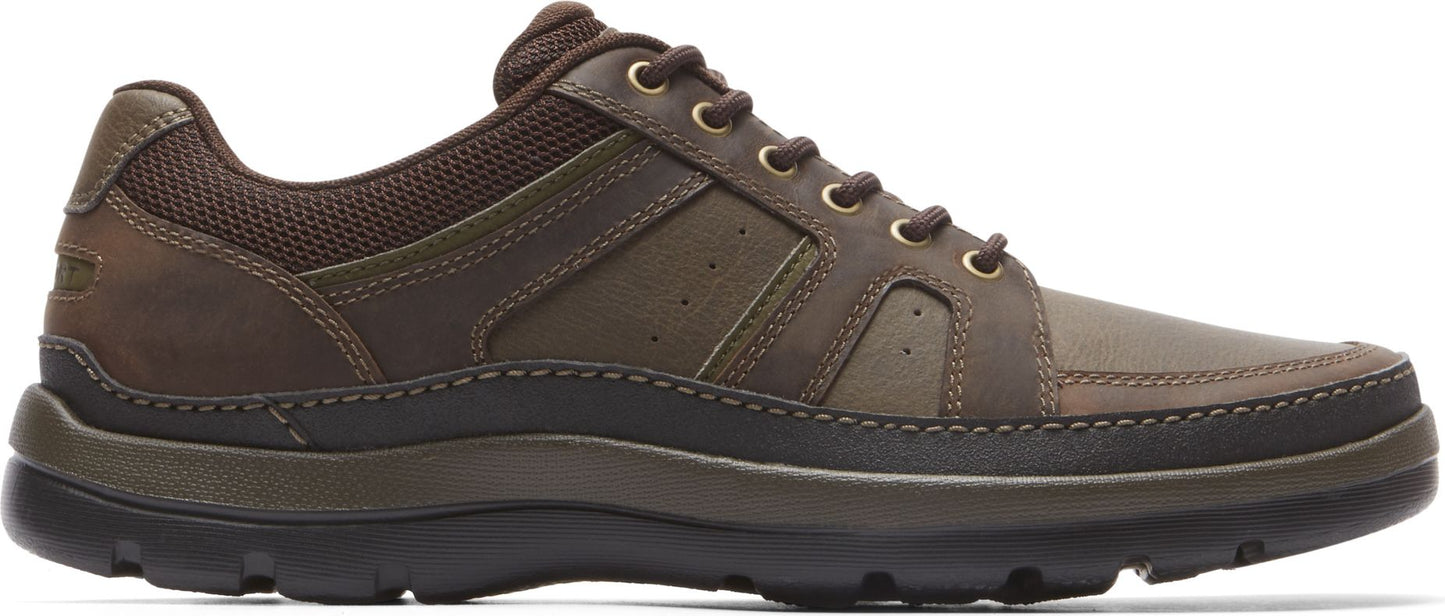 A brown leather walking shoe with laces.
