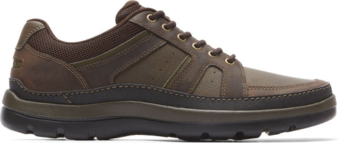 A brown leather walking shoe with laces.