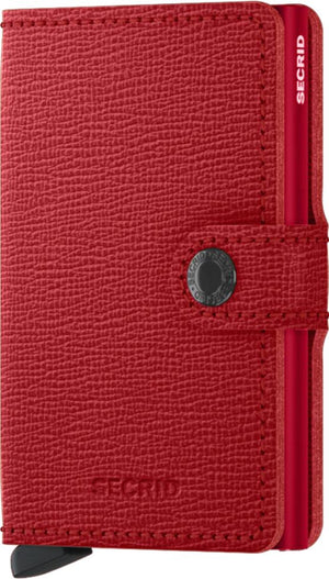 Red wallet with button closure and 'SECIRD' text.