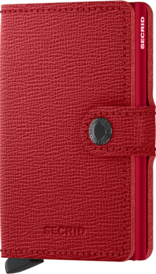 Red wallet with button closure and 'SECIRD' text.