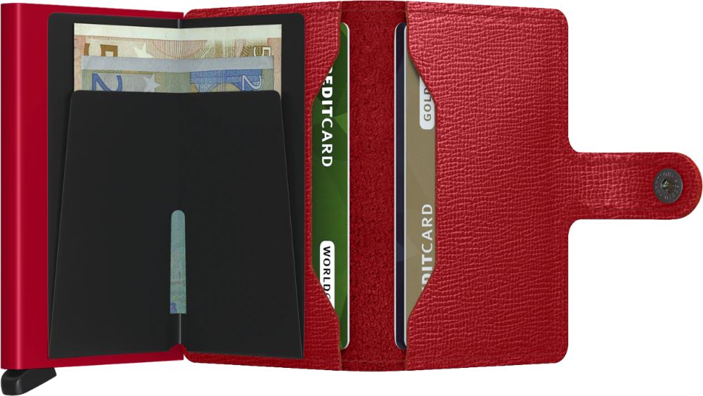 Open red wallet with multiple slots holding cash and credit cards.