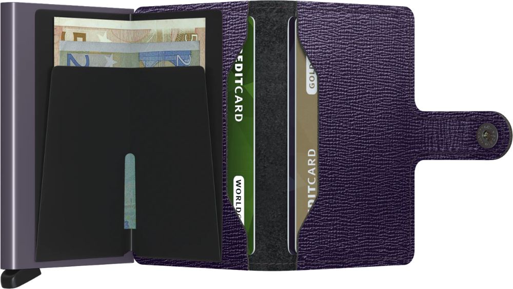 Open purple wallet with a button closure, a silver card protector displaying euro notes, and card slots containing credit cards.