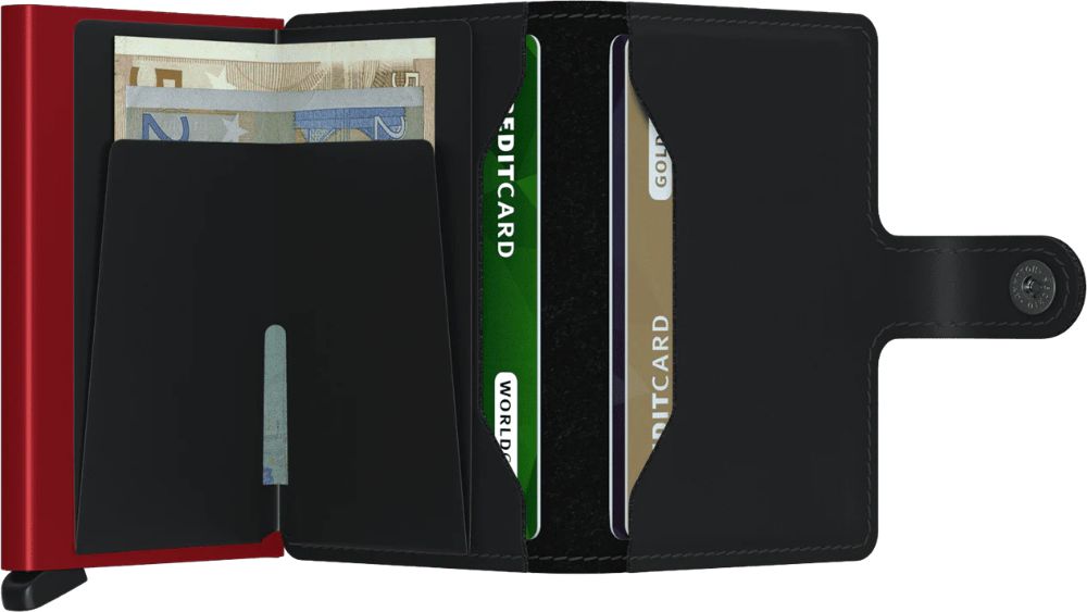 Open wallet with red card protector, cash, and multiple credit cards.