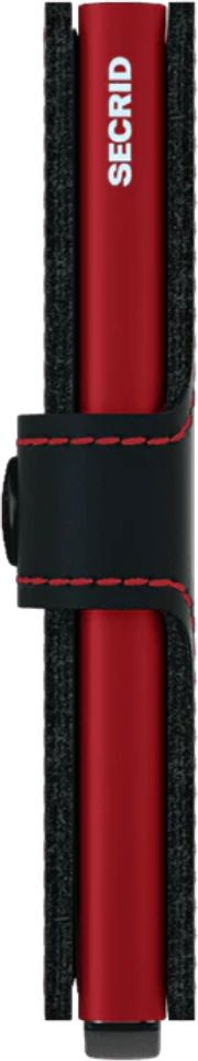 A red Secrid cardholder with a black strap.