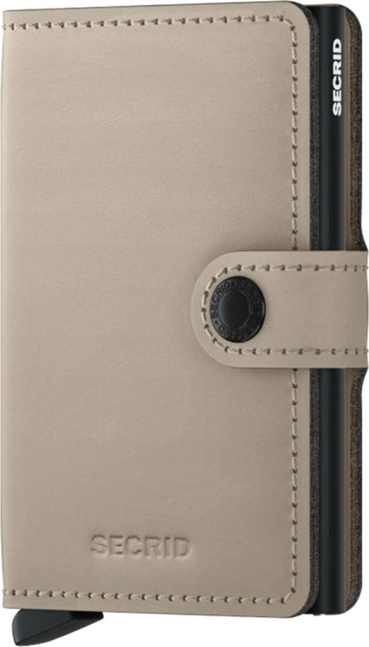 Beige wallet with a snap closure and the text "SECRID" printed on it.