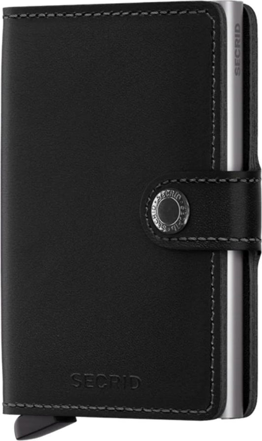 A small, black leather wallet with a silver metal cardholder on its right side and a silver button closure.