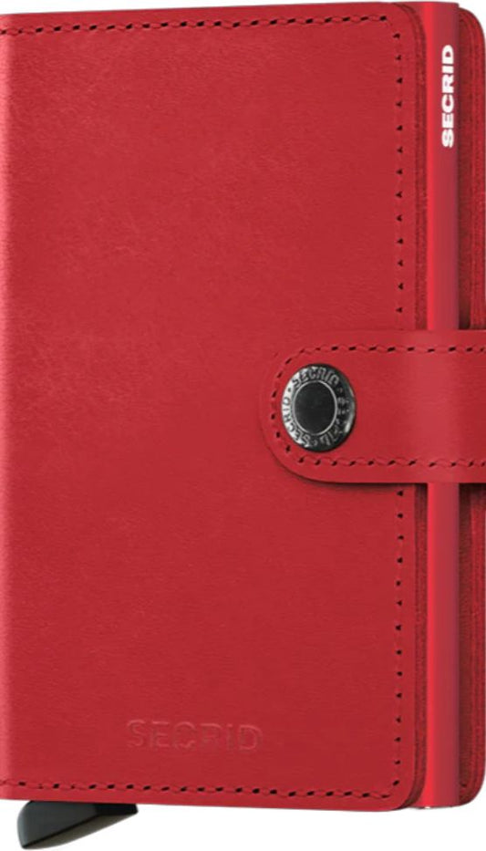 Small, red leather wallet with a metal button and the text "SECID".