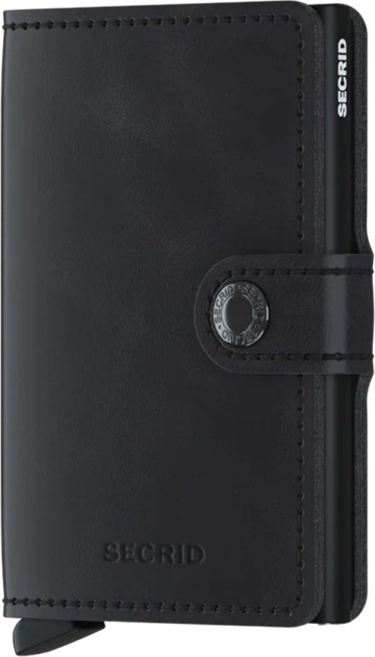 Black wallet with button closure and logo visible on the corner and bottom edge.