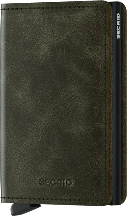 Closed olive green leather card holder with visible logo and ejector.