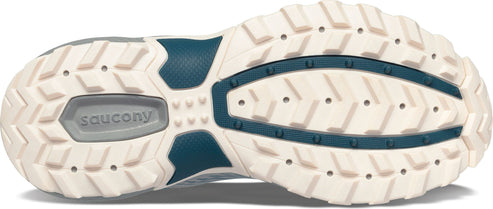 Bottom view of a shoe with a textured beige and teal sole showing the brand logo.
