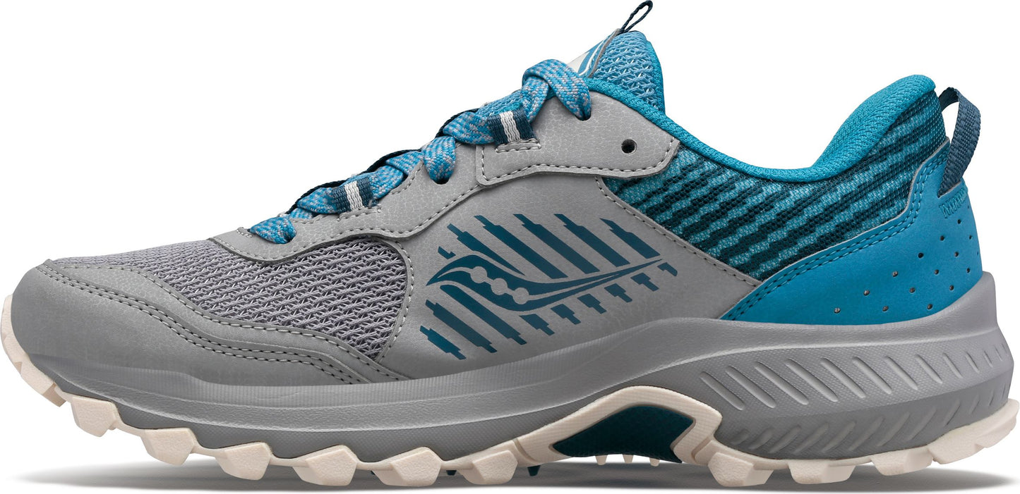 A gray and blue trail running shoe with a rugged outsole.
