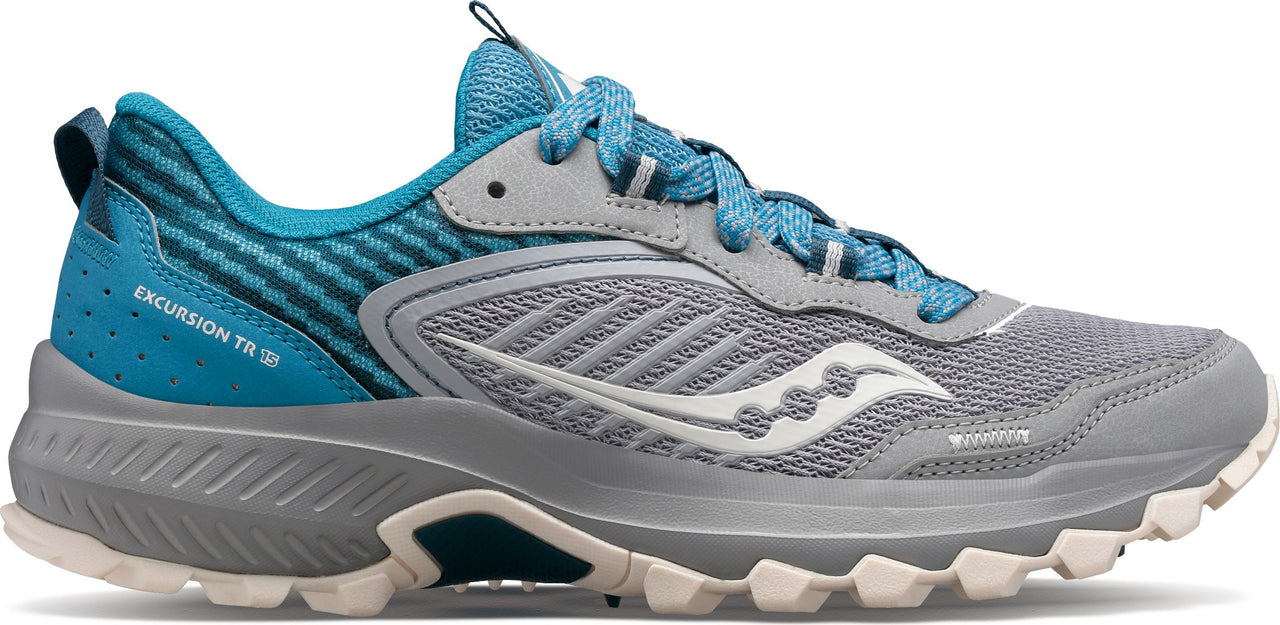 A gray trail running shoe with blue accents.
