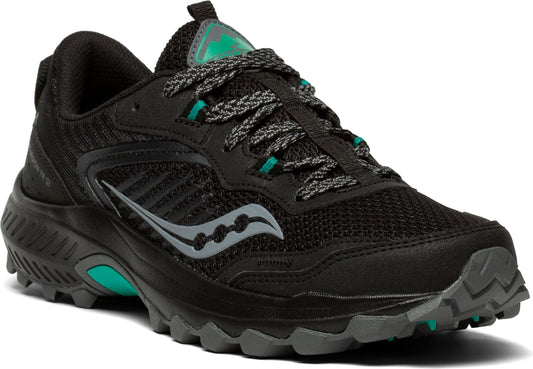 Black running shoe with a gray logo and green accents.