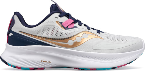 A running shoe in white with gold stripes, pink accents, and a thick white sole.