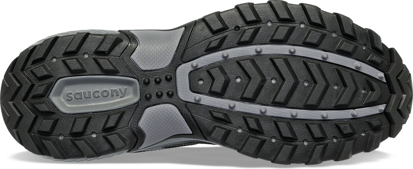 The sole of a black shoe with a gray midsection and small gray protrusions.