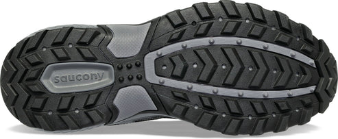 The sole of a black shoe with a gray midsection and small gray protrusions.