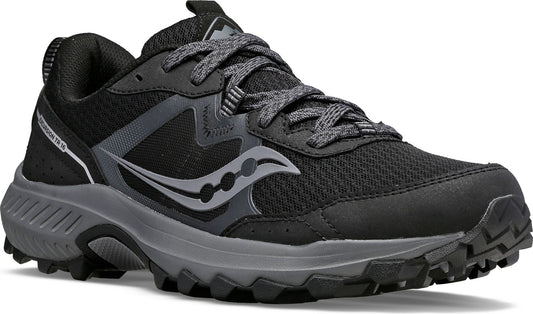 A black and gray athletic shoe with lug soles and gray laces.