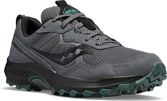 Gray and black trail running shoe with black laces and green details.
