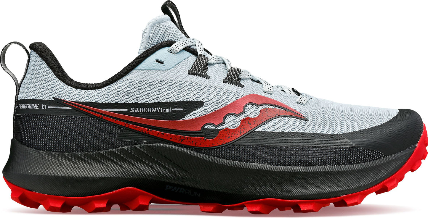 Trail running shoe, light blue upper, red logo, black midsole and red outsole.