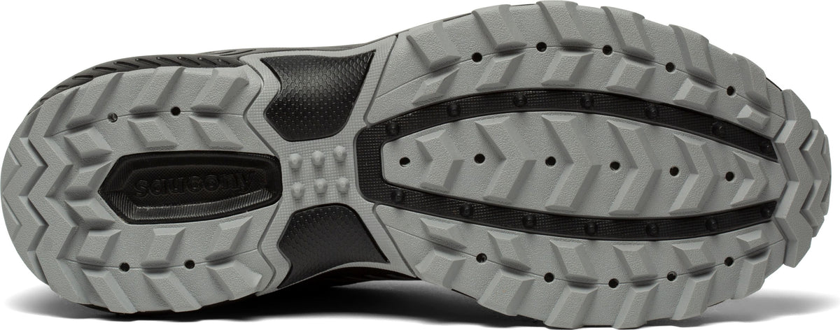 Close-up of a shoe sole featuring a gray pattern with dark lines and small dots.