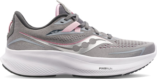 A gray athletic shoe with white sole and pink accents.