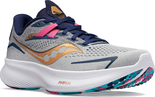 Athletic shoe with white sole, grey mesh upper, navy blue laces and accents, pink accent on tongue.