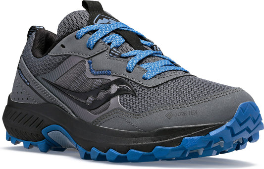 A gray, low-top athletic shoe with blue laces and tread.