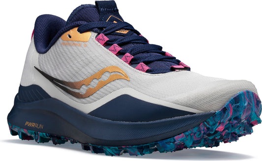 Low profile trail running shoe with a white upper, navy trim, gold logo, pink accents and a multi-colored sole.