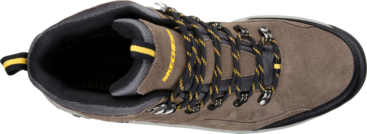 Top-down view of a high-top hiking shoe with black and yellow laces.