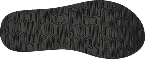 Bottom of a sandal with hexagonal and linear tread pattern.