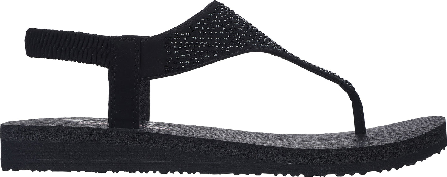 A black sandal with a slingback and toe thong.