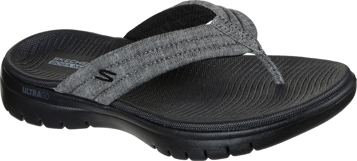 A gray flip-flop with a fabric strap and a black sole.