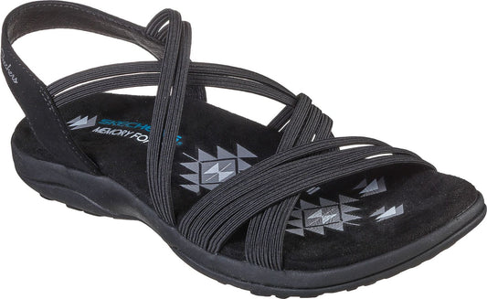 Black sandal with elastic straps crossing over the foot.
