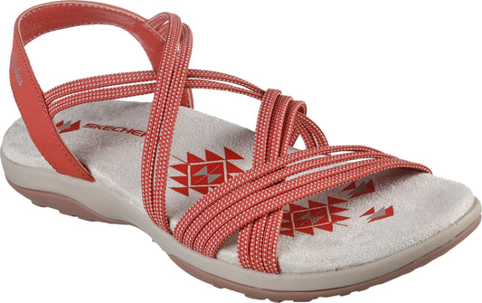 Coral-colored sandals with crisscrossing straps and a tan sole.