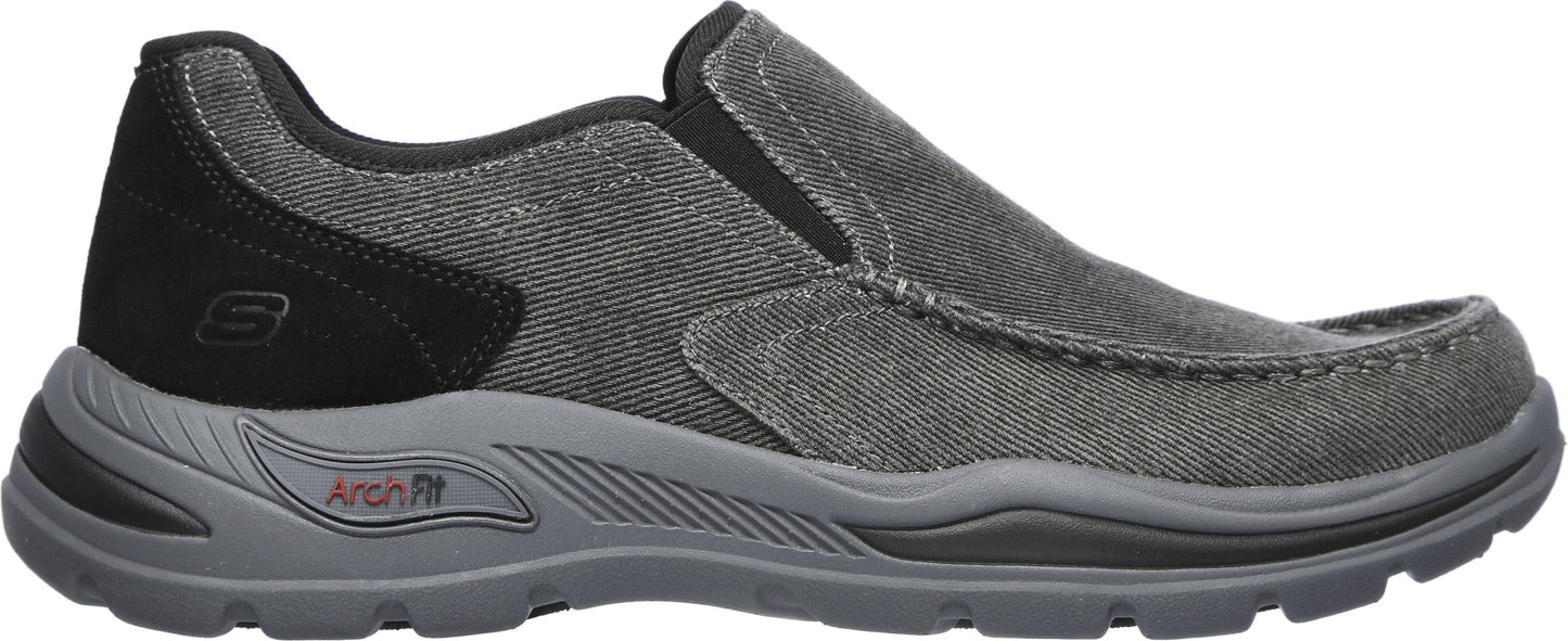 A gray casual slip-on shoe with an arch fit.