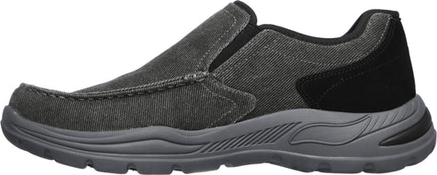 A slip-on, low profile shoe in gray with a black heel.