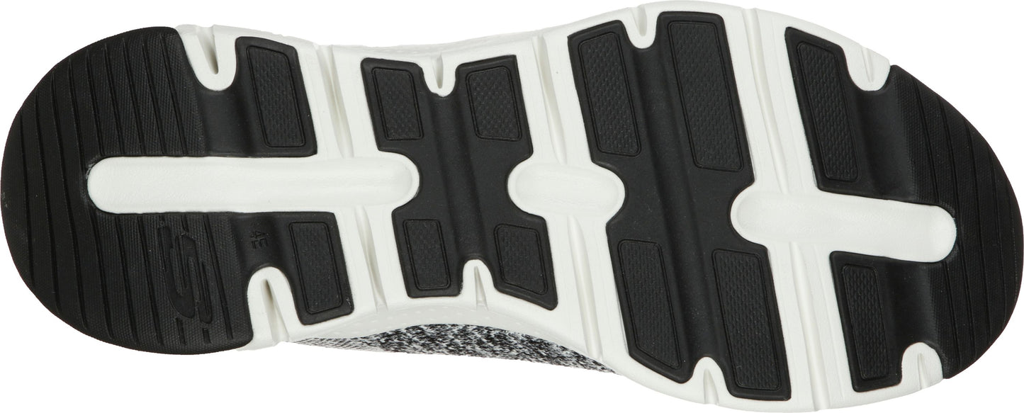 Bottom view of a shoe with a black and white sole.