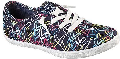 A canvas sneaker in navy blue with colorful heart patterns and white laces.