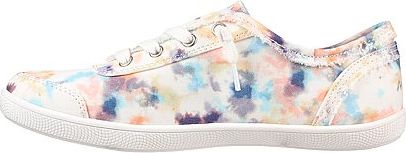 A tie-dyed canvas shoe with white laces and a rubber sole.