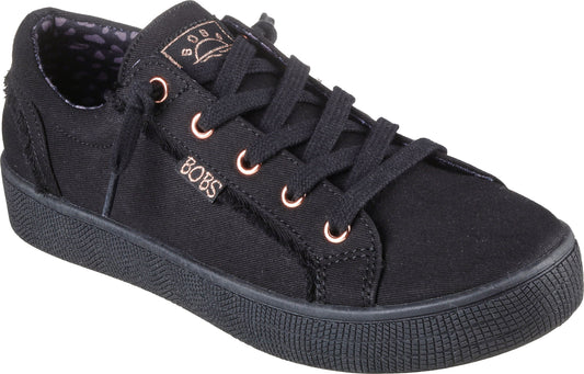Black canvas sneaker with black laces and metallic eyelets.