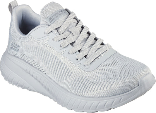 Light gray athletic shoe with a knit upper and a thick sole, lace-up closure.