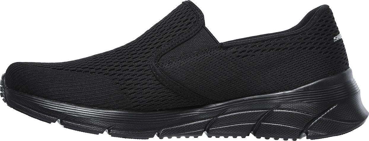 A black slip-on sneaker with a mesh upper and a thick sole.