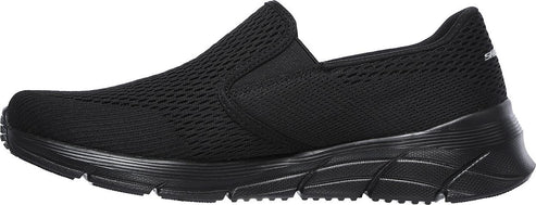 A black slip-on sneaker with a mesh upper and a thick sole.