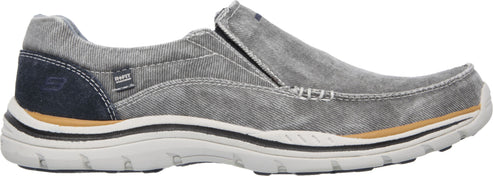 A grey slip-on shoe with a white sole.