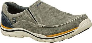 A gray slip-on shoe with a tan and black sole.