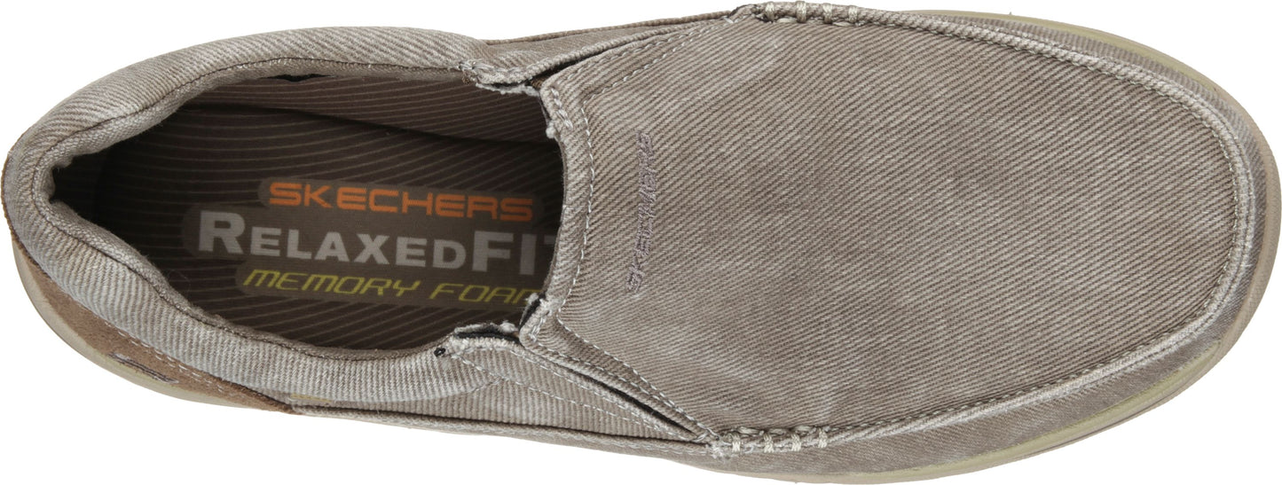 Slip-on shoe with visible "SKECHERS RELAXED FIT memory foam" logo on the insole.